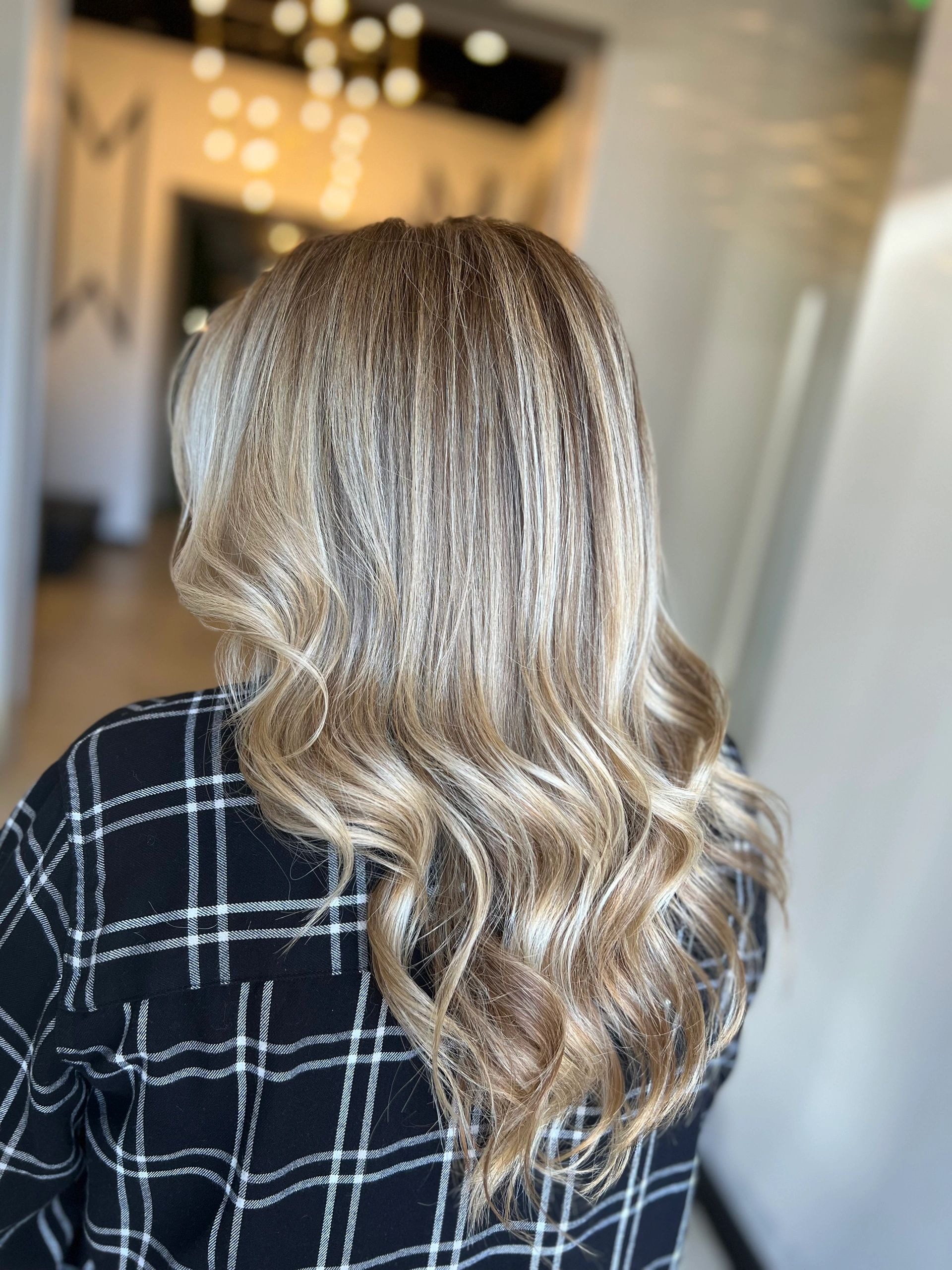 Blonde wavy hair back view